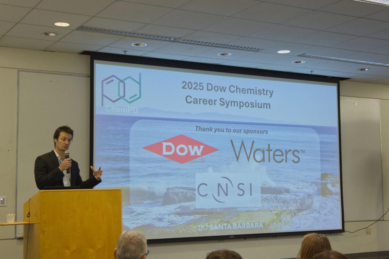 Emile Morin Standing by Podium